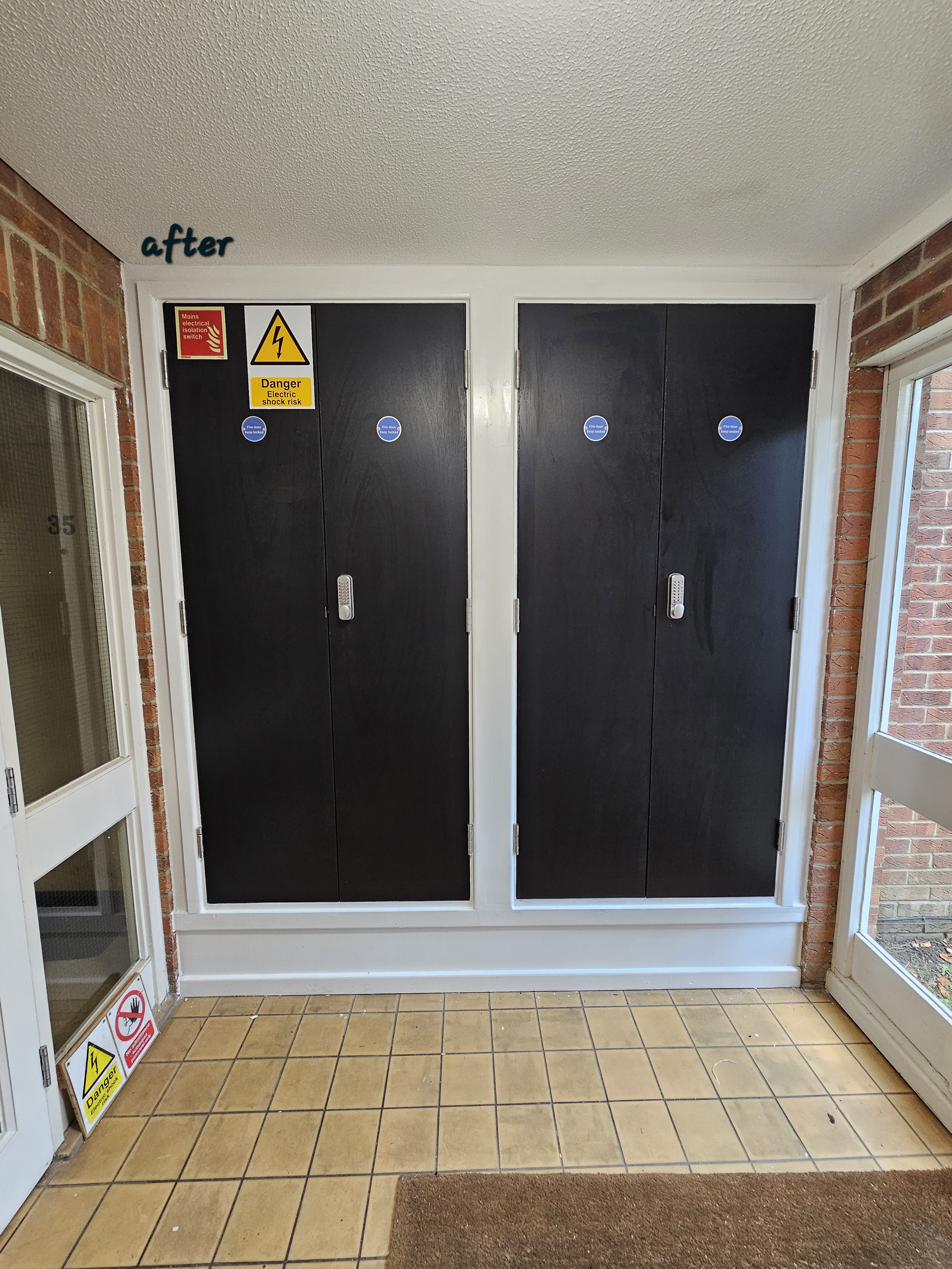 Commercial door painting and refinishing in West London - black gloss finish on double doors