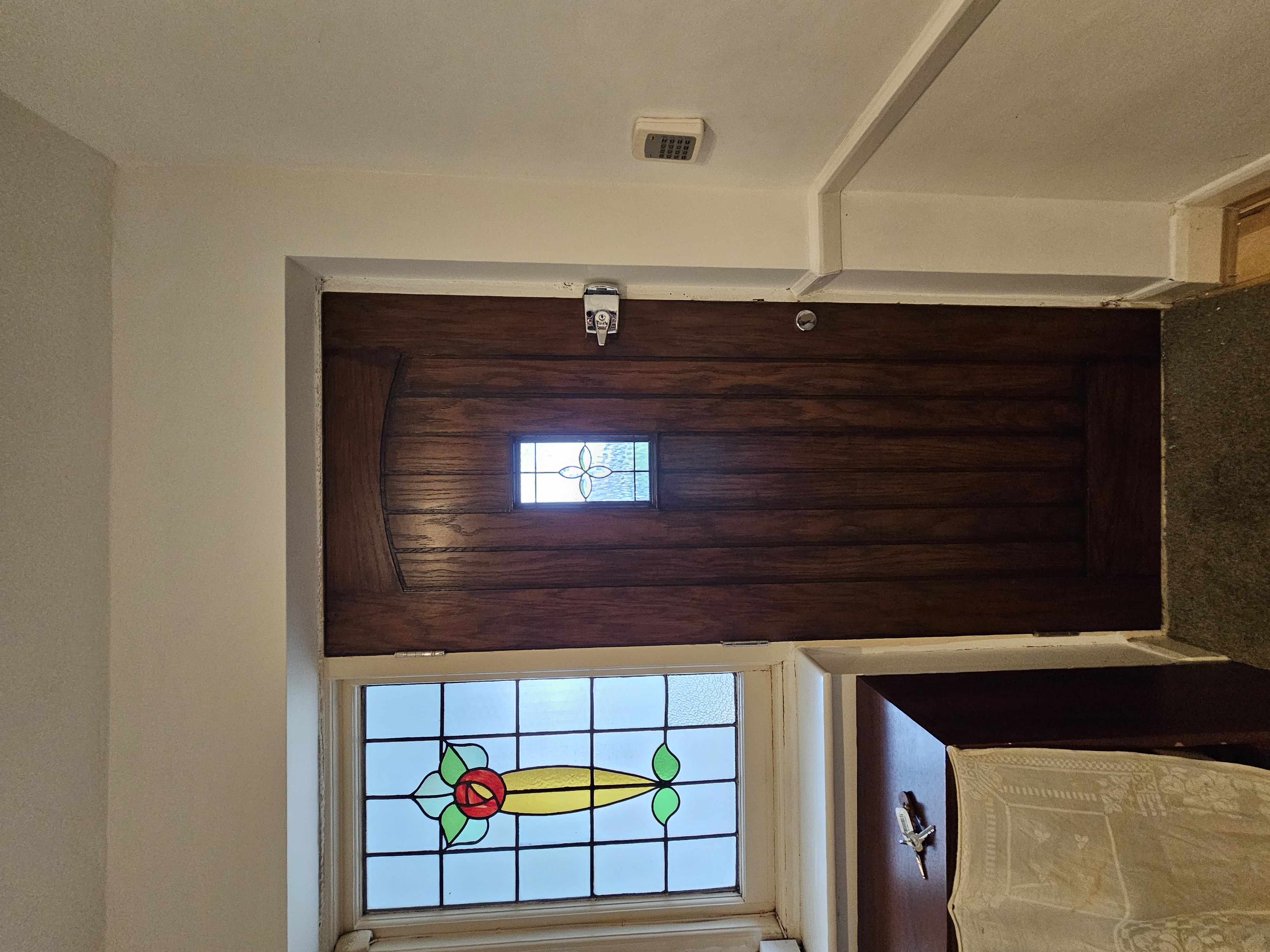 Interior door restoration in Surrey - dark wood stain with period features preserved