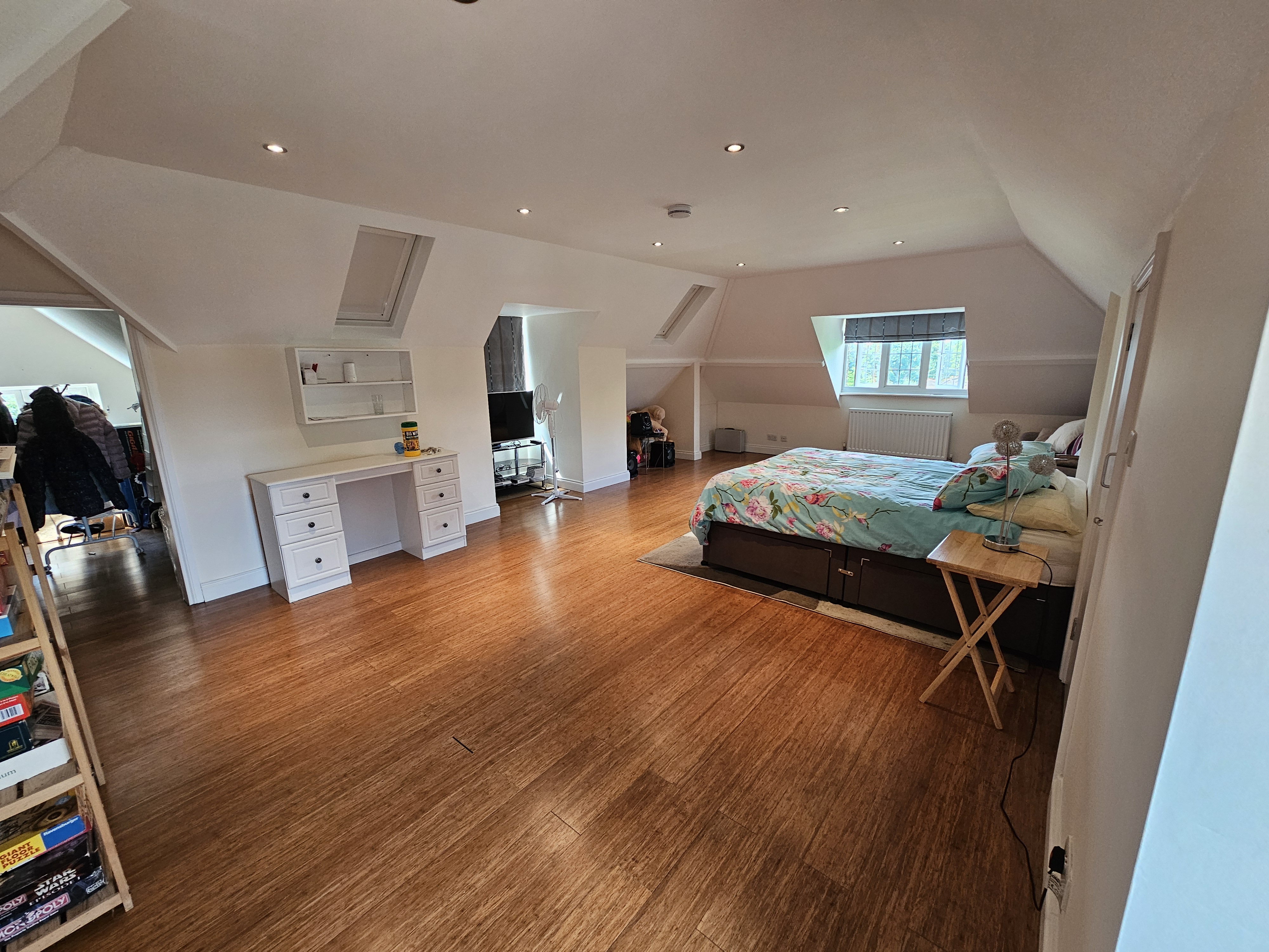 Loft conversion painting and decorating in Berkshire - bedroom with vaulted ceiling and roof windows
