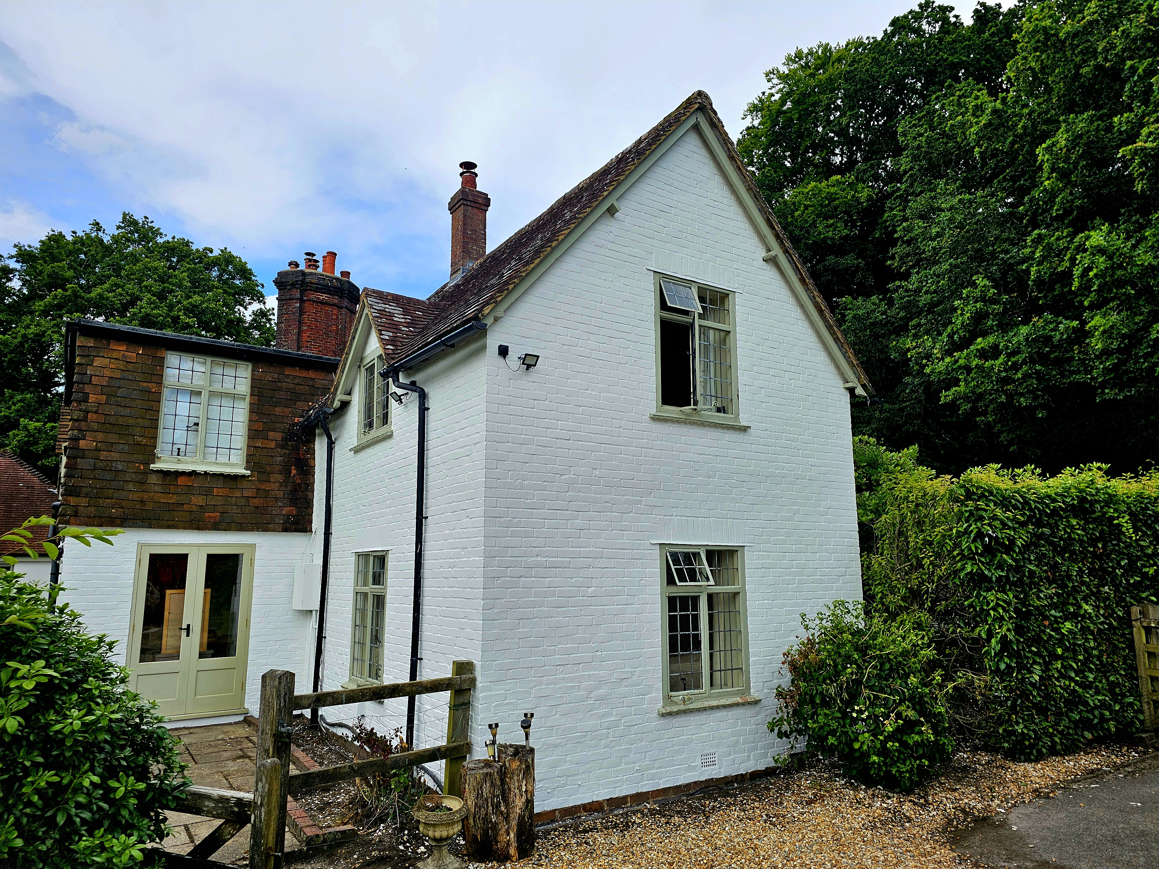 Full house exterior painting project in West London - large property with garden